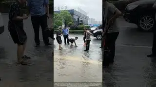 Man Catches Fish in Flooded City Streets After Heavy Rain