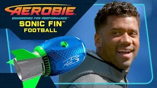 NFL quarterback Russell Wilson throws The Aerobie Sonic Fin Football!