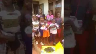 Divine child care ministries orphanage children receiving scholastic materials