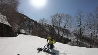 Riding on a snowscoot for the first time!