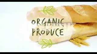 animation of organic produce text banner against close up of fresh bread and wheat ears