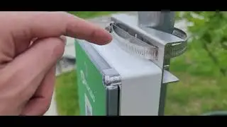Plugzio Universal installed outdoors on galvanized post