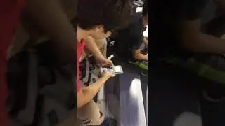 Dude plays games on calculator at high school football game