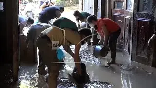 Thousands of volunteers arrive in Spanish town of Paiporta, the hardest hit in devastating floods