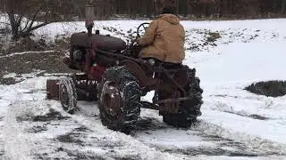 International Farmall 100 tractor with snow plow, runs