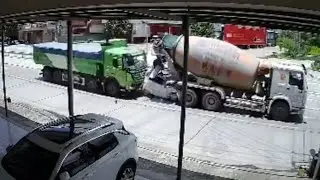 Car slams into cement mixer after truck collision, driver miraculously survives