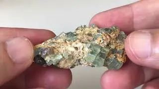 Multiple Aquamarine crystals and fragments and Smoky Quartz in natural matrix
