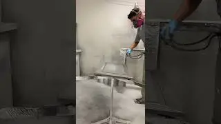 Spraying a cabinet door with this pigmented grey color!
