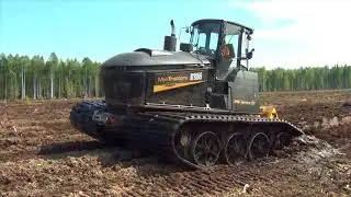 Tracked carrier Suocco S500 clearing new peat land with Meripeat ditcher in summer conditions