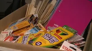 Comcast hands out school supplies