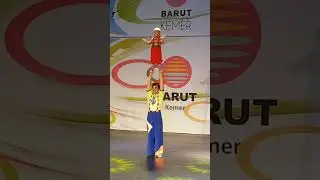 Dynamic Duo: Boy Acrobat Joins Acrobatic Extravaganza!
