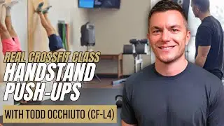 Level 4 Coach teaches handstand push-ups in REAL CrossFit class