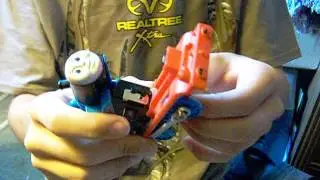 Changing batteries on Thomas Railway engines with blue plastic track.