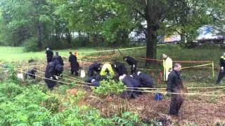 Mobile Police search for evidence after officer is shot