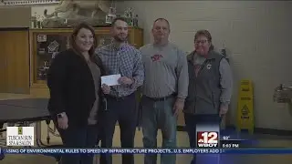 MPLX representatives presents a check to Mountaineer Middle School