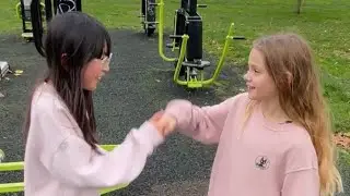 Ottie and her friend Jenny face off at the outdoor gym 