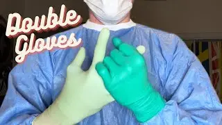 Male Doctor Puts on Two Pairs of Latex Gloves