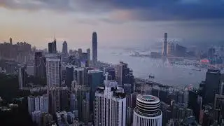 Time lapse drone footage of Victoria Harbor with moving ships and impressive Hong Kong city