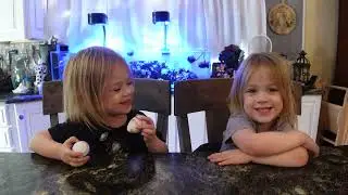 Twins try tootsie pop