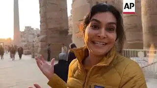 Visitors watch sun align with ancient Luxor temple
