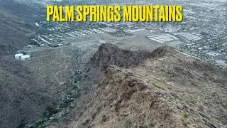 Flying over Palm Springs Mountains and Houses