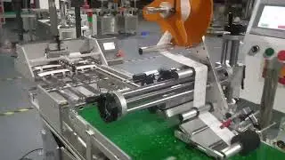 Friction Feeder Stream Feeder + Sticker Labeling Machine + Vacuum Transport Table