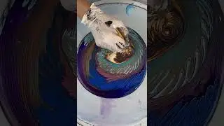 Left over paint pout with blue, violet and gold pour
