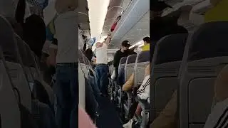 putting handcarry into overhead cabin ,passenger plane #shorts #asmr