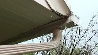 drain from gutter clogged on house overflowing slow motion