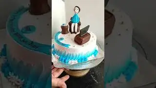 Fondant character on chair, Tv set n newspaper
