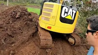Cat 314E Excavator Ripping and Grading Road Along Fence Line
