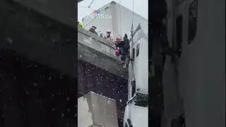 High-angle rescue of truck driver as cab left dangling from bridge