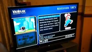Custom Vewlix arcade cabinet and mirrored TV emulator setup showcasing updated GameEx theme