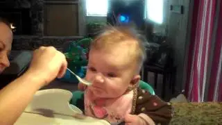 Ryleigh, 4.5 months old, TRYING to eat bananas for the first time.