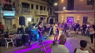 Iconic Italian rock band performs legendary hit in a charming Italian Village.
