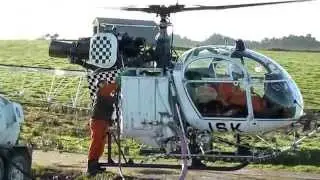 Lama SA315B Helicopter Loading Chemical.