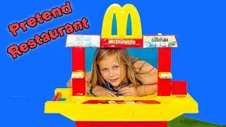 Assistant Operates a Pretend Drive Thru Restaurant