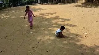 দুই ভাই বোনের মাঠে খেলার দৃশ্য 