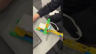 Yikai demonstrating his Helicopter robot that spins for a set number of rounds