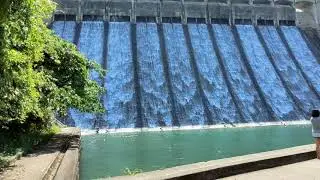 raw video, nothing special: Tai Tam reservoir overflow dam, water overflowing, Hong Kong waterworks