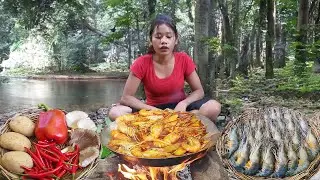 Cooking and eating lobster curry with potatoes and mushrooms in forest