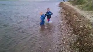 Isaac thinks his puddle suit is a wet suit!