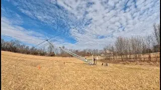 Raising a US Tower HDX-72 tower with SteppIR DB32 on top.