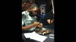 Damien Robinson wins the Liberty Bowl rib eating competition
