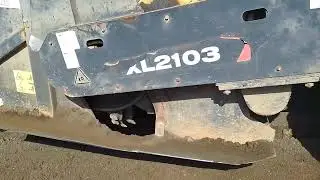 Massive Road Reclaimer Pulverizing and Mixing the Base