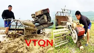 A farmer working in the rice field with a clattering tractor