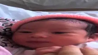 New born baby smile to the world for the first time