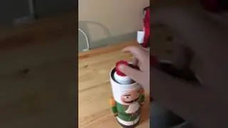 Testing fake winter spray snow and a nutcracker tin