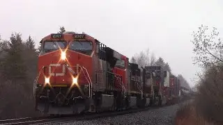 Four Engines Power a Big CN Train 406 West at Salisbury, NB on the Rain