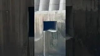 Dam Sluice gate opening with 20cumecs discharge into river downstream
